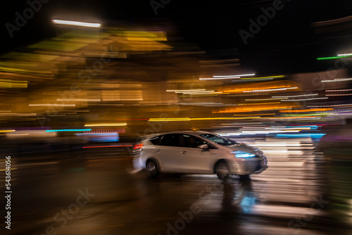fast moving cars in the night city