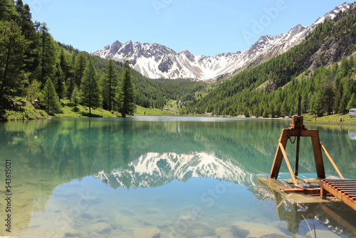 The wonderful Orceyrette Lake in spring with larch tree forest, Briancon, hautes alpes, french alps