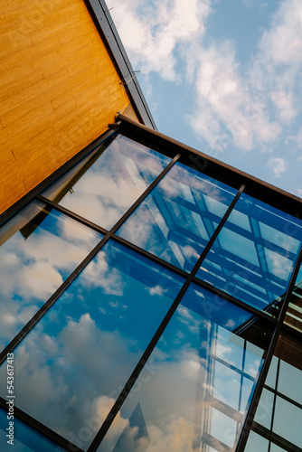 Modern office building with clouds and glass