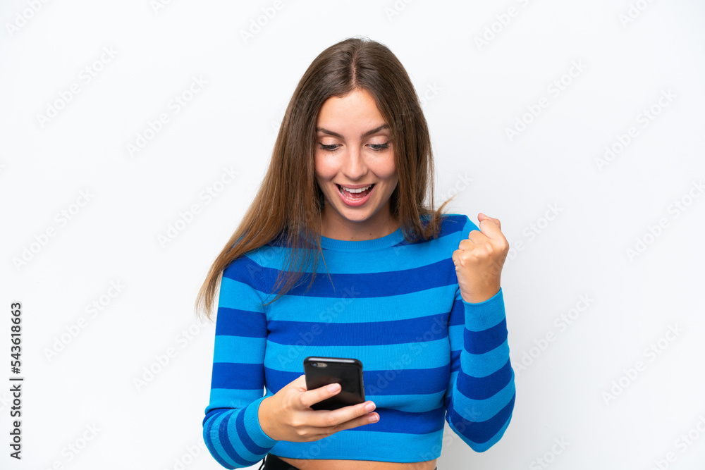 Young caucasian woman isolated on white background surprised and sending a message Young caucasian woman isolated on white background surprised and sending a message