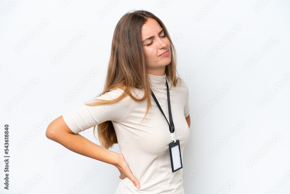 Young pretty woman with ID card isolated on white background suffering from backache for having made an effort Young pretty woman with ID card isolated on white background suffering from backache for having made an effort