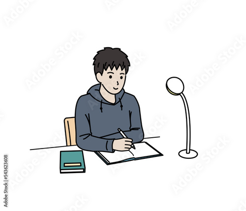 自宅で勉強をする中高生の男の子