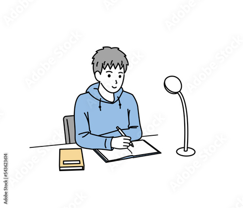 自宅で勉強をする中高生の男の子