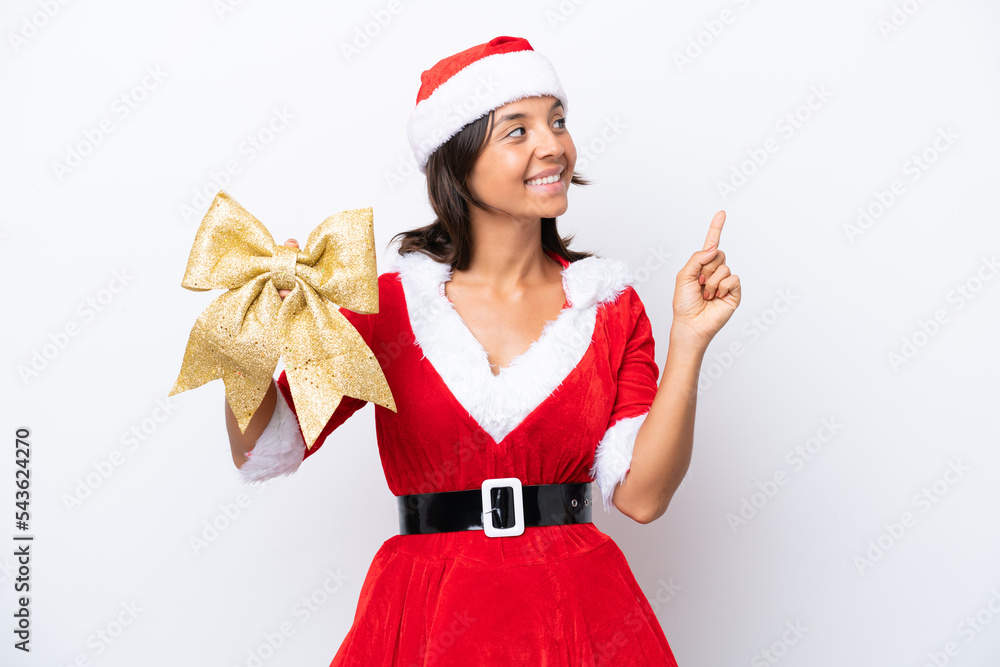 Young hispanic woman dressed as mama noel holding a Christmas bow isolated on white background pointing up a great idea Young hispanic woman dressed as mama noel holding a Christmas bow isolated on white background pointing up a great idea