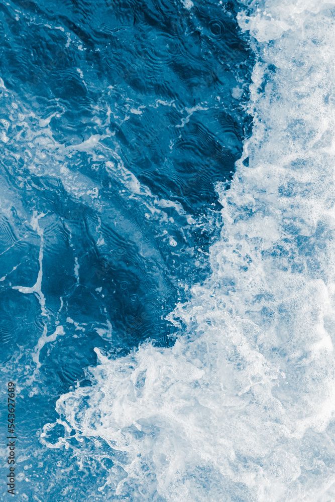 Dark blue sea ocean wave and white foam