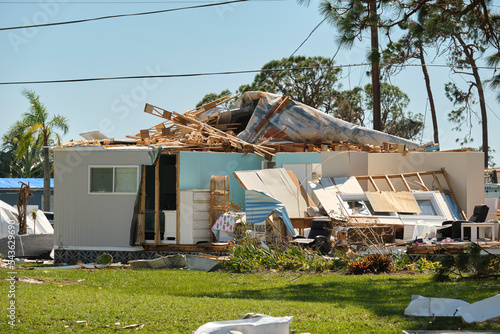 Εκτύπωση καμβά Severely damaged house after hurricane Ian in Florida mobile home residential area