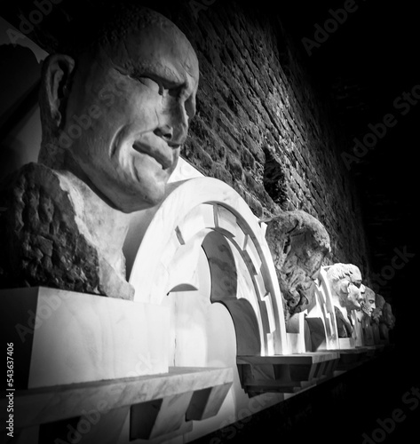 Ancient stone heads in the Crypt of Sienna Cathedral , Tuscanny Italy photo