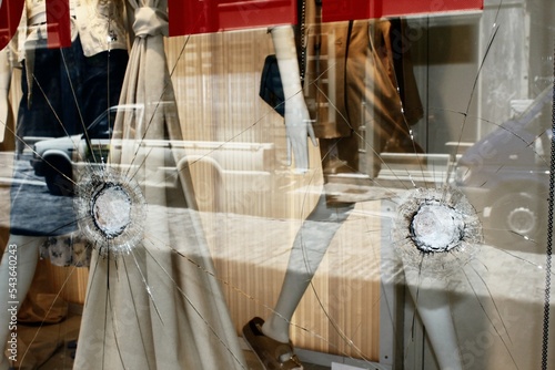 Broken glass of store window at Ermou street, in the commercial center of Athens, after vandalism made by anarchists - Athens,  Greece, June 28 2020. photo