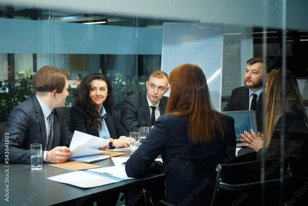 Top managers discussing project at business meeting Top managers discussing project at business meeting