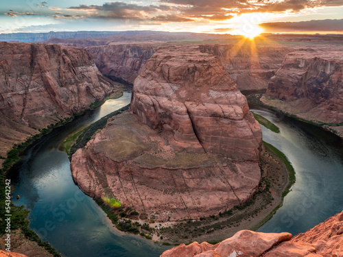 Horseshoe Bend during sunset with dramatic cloudy sky, Arizona, United States