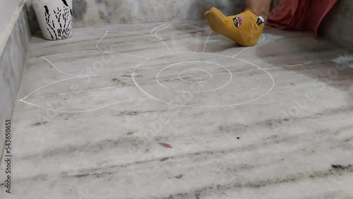 Time lapse footage of a girl making rangoli on the occasion of Diwali with flowers. Deepavli or Dipawali celebration and decoration.
 photo