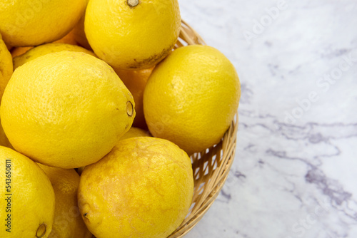 wicker basket with fresh lemons