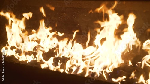 Flames burning paper on a fire pit