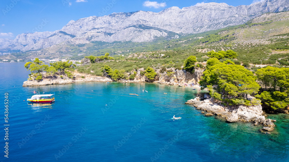 A beautiful view of Makarska/Tucepi beach through the pines. Dalmatia, Croatia.