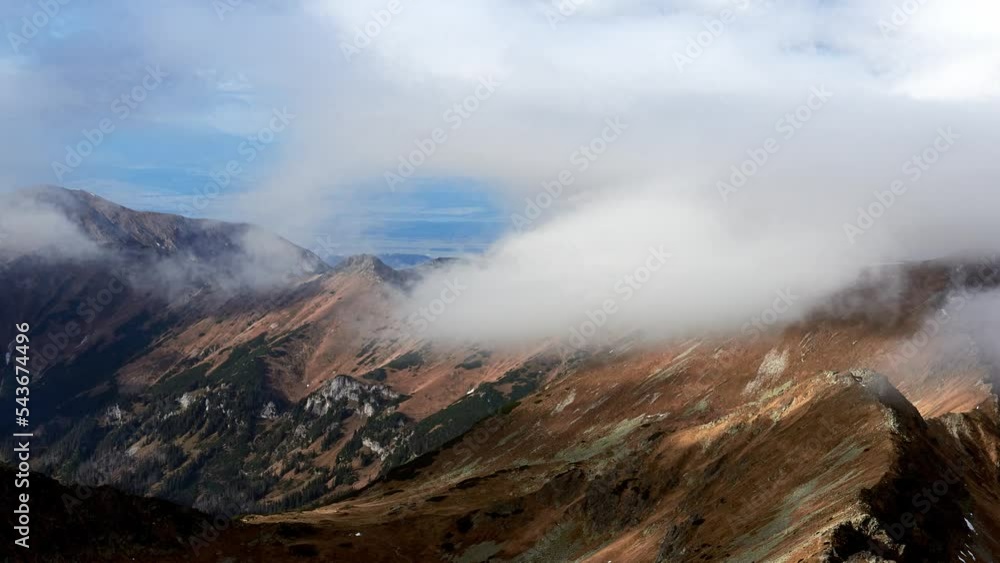 Autumn mountain landscape, clouds pass over the mountain ridge. Light and shadow of clouds . Autumn mountain landscape, clouds pass over the mountain ridge. Light and shadow of clouds .