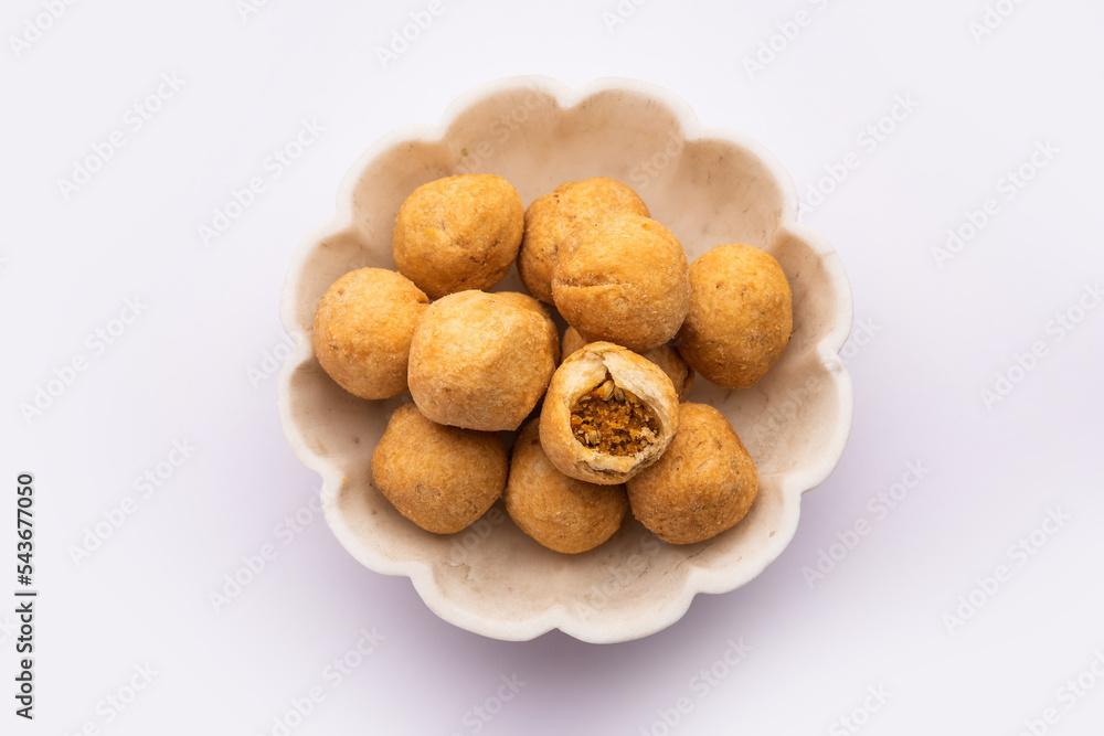 Dry kachori is a dry fruits stuffed ball shaped farsan also called kachauri, kachodi and katchuri - obrazy, fototapety, plakaty 