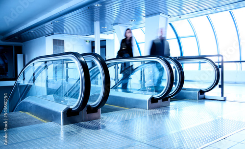 Escalators in modern business center photo