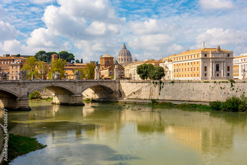 St Peter's basilica dome in Vatican and Victor Emmanuel II bridge over Tiber riber, Rome, Italy photo