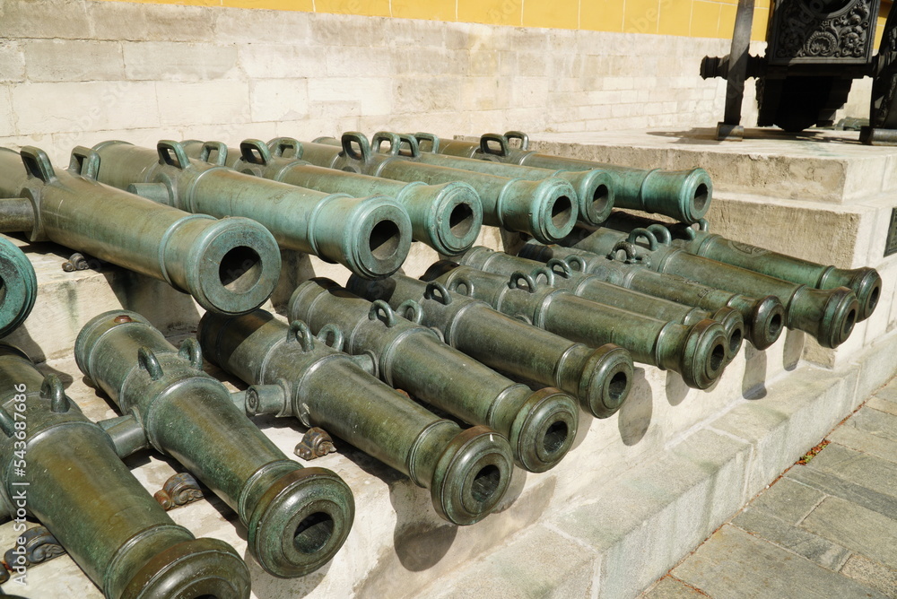 Kremlin, Red Square, Moscow. Russia - August 28, 2022: An old cannon and barrels Kremlin, Red Square, Moscow. Russia - August 28, 2022: An old cannon and barrels