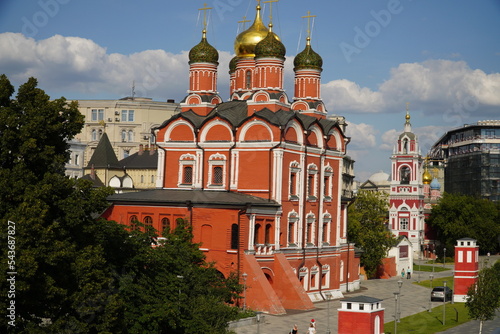 Moscow, Russia - August 28, 2022: Znamensky cathedral on Varvarka street and Zaryadye park in Moscow, Russia photo