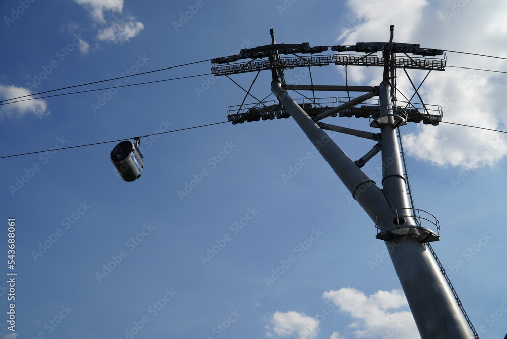 Moscow, Russia - August 28, 2022: first Moscow cable car over the river Moskva in background of Luzhniki stadium. Moscow, Russia - August 28, 2022: first Moscow cable car over the river Moskva in background of Luzhniki stadium.