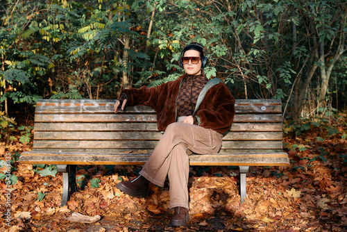 Photography Woman sitting on a park bench