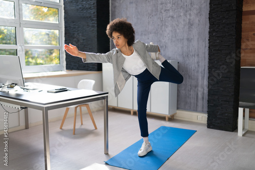 Happy Young Businesswoman Doing Stretching Exercise