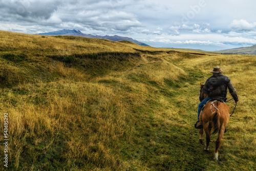 "Chagras" cowboys riding on the moors of Cotopaxi National Park
