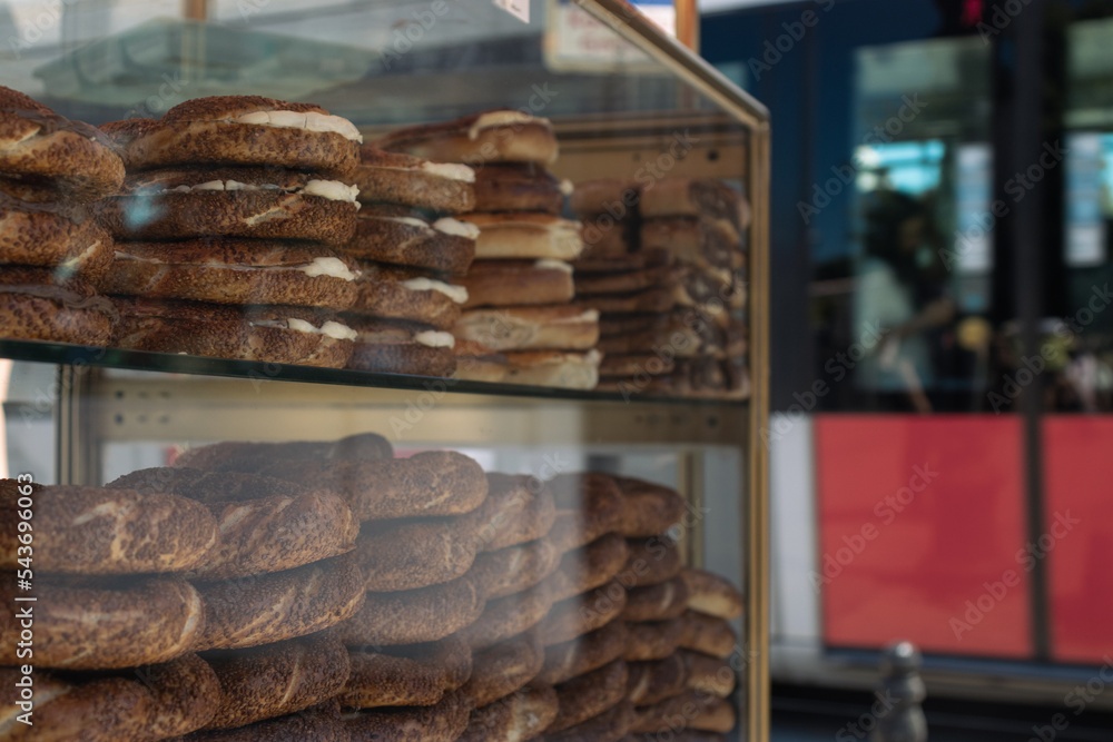 close-up photo of bagels at the bagel stand with tram in the background close-up photo of bagels at the bagel stand with tram in the background