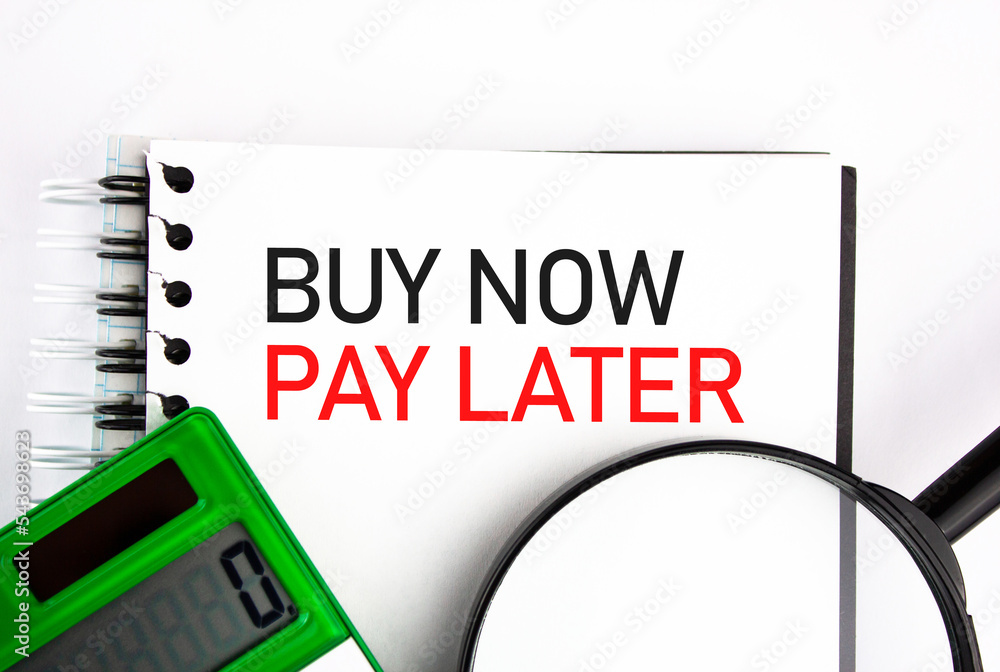 Naklejka premium BNPL Buy now pay later - text concept next to calculator. The concept of bargain purchases in installments, credit.