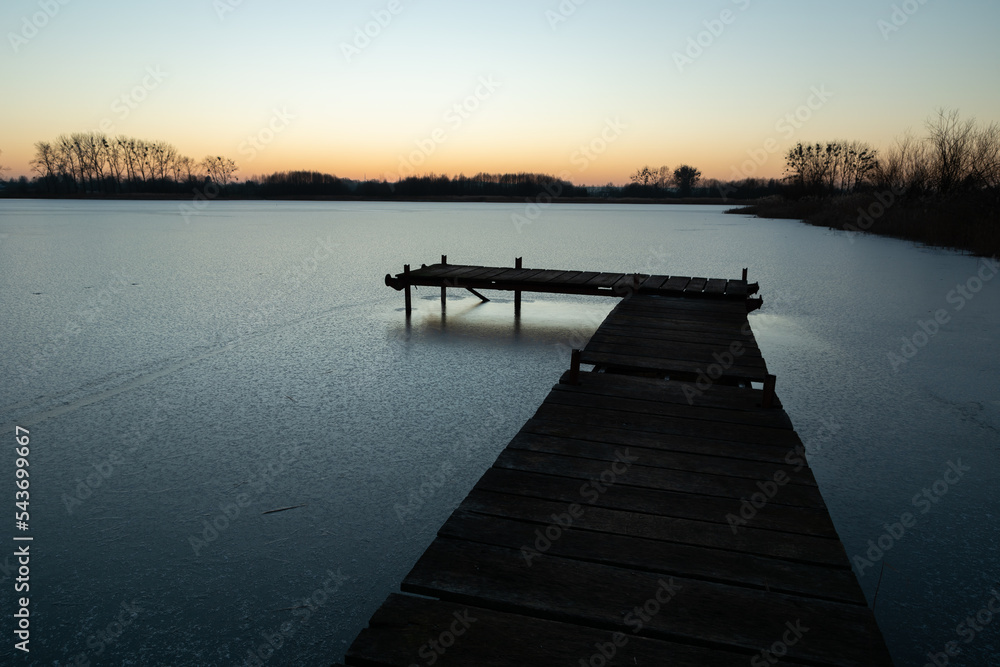 Wooden pier and a frozen lake, Stankow, Poland