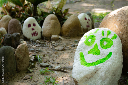 Rocks decorated as skulls with paint festival of the day of the dead in Mexico