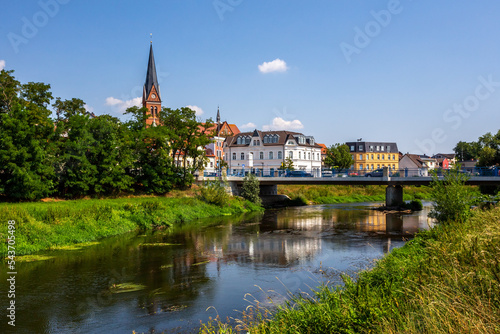 Historical city of Stassfurt withe the river Bode in front, Germany  photo