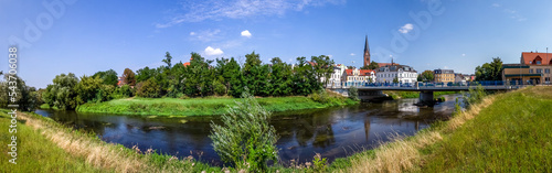 Historical city of Stassfurt withe the river Bode in front, Germany  photo