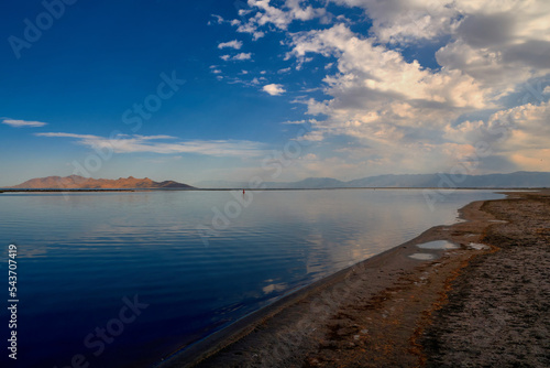 Looking east over the Great Salt Lake at Antelope Island and the Wasatch mountains, in the morning light at the Great Salt Lake State Park in Utah.. photo