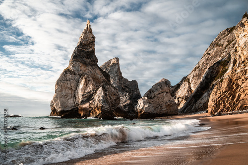 The beautiful rock formations of Praia Da Ursa at sunset, on the western coast of Portugal
