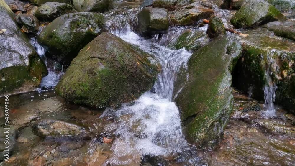Cold water flows through the stones. Mountain Creek Cold water flows through the stones. Mountain Creek