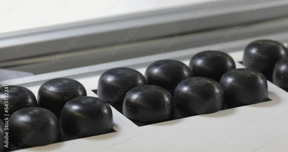 Black Plastic Parts at Conveyor Belt Production Line Factory Black Plastic Parts at Conveyor Belt Production Line Factory