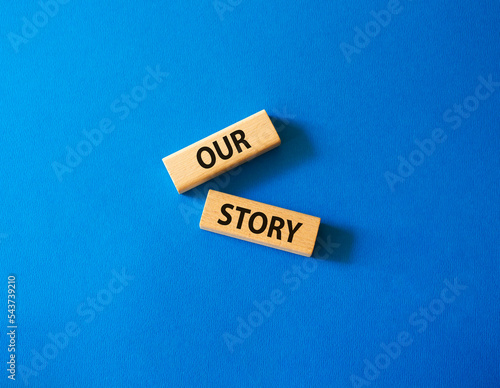 Our story symbol. Wooden blocks with words Our story Beautiful blue background. Business and Our story concept. Copy space.