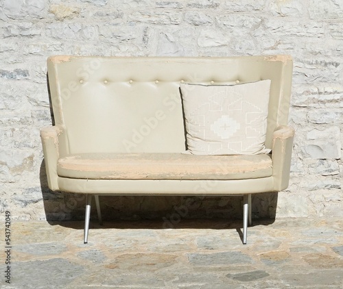 Light colored double seat couch with cushion
