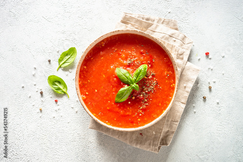 Tomato soup. Traditional vegetable soup. Top view on white with copy space.