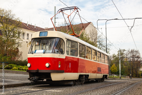 Old Tram on street of Prague in an autumn day, Czech Republic. Prague tram network is the third largest in the world. Development of passenger eco-friendly electric transport connection in the Europe 