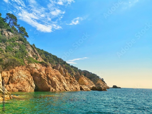 Beautiful shot of the rocky Costa Brava over the water in Spain Fototapet