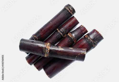 Close up of Segment sugar cane or Saccharum officinarum isolated on a white background.