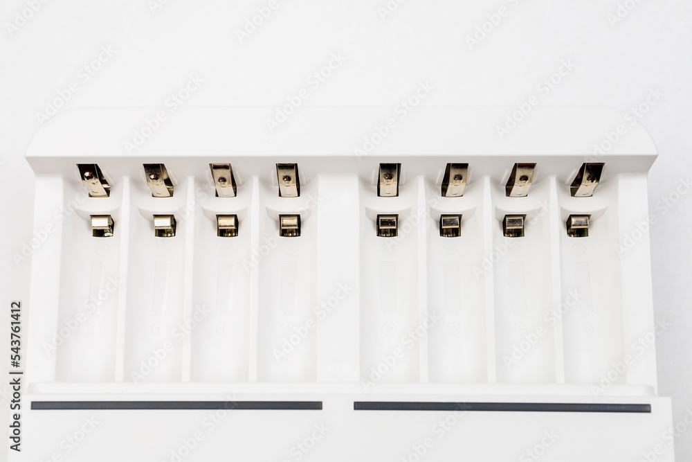 Cells with contacts for charging rechargeable batteries with selective focus and blurred background. Cells with contacts for charging rechargeable batteries with selective focus and blurred background.