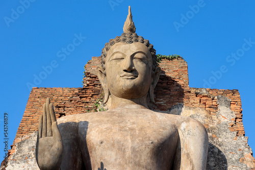 A Buddha statue at Wat Saphan Hin in the precinct of Sukhothai Historical Park. UNESCO World Heritage Site in Thailand.