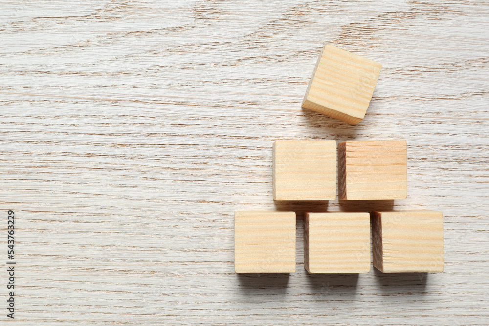 Blank cubes on white wooden table, flat lay with space for text. Idea concept Blank cubes on white wooden table, flat lay with space for text. Idea concept