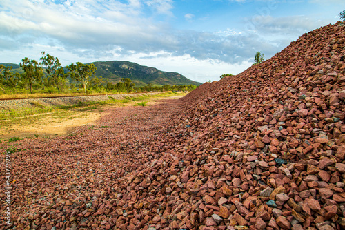 Gravel pile with mountain in background