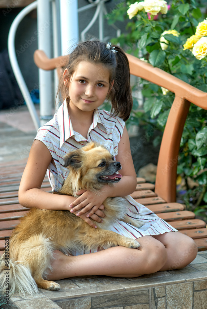 Portrait of a girl with her beloved dog.