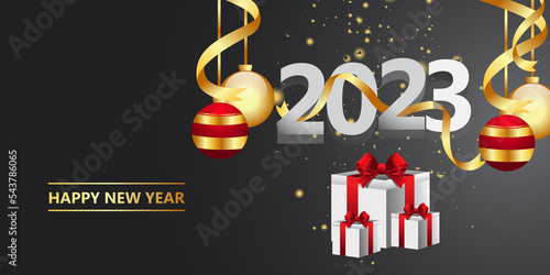Happy new year 2023.golden Christmas decoration and confetti onbackground. Holiday greeting card design.